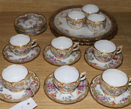 A set of nine Dresden coffee cups and saucers and two Limoges plates